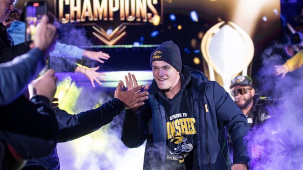 Michigan quarterback J.J. McCarthy celebrates the team’s national championship.